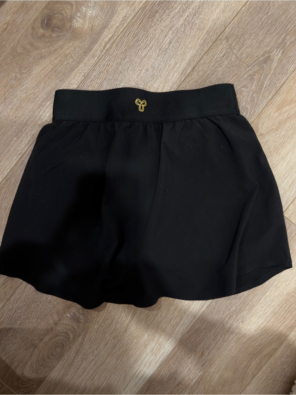 Aritzia Black Athletic Skort with Gold Emblem